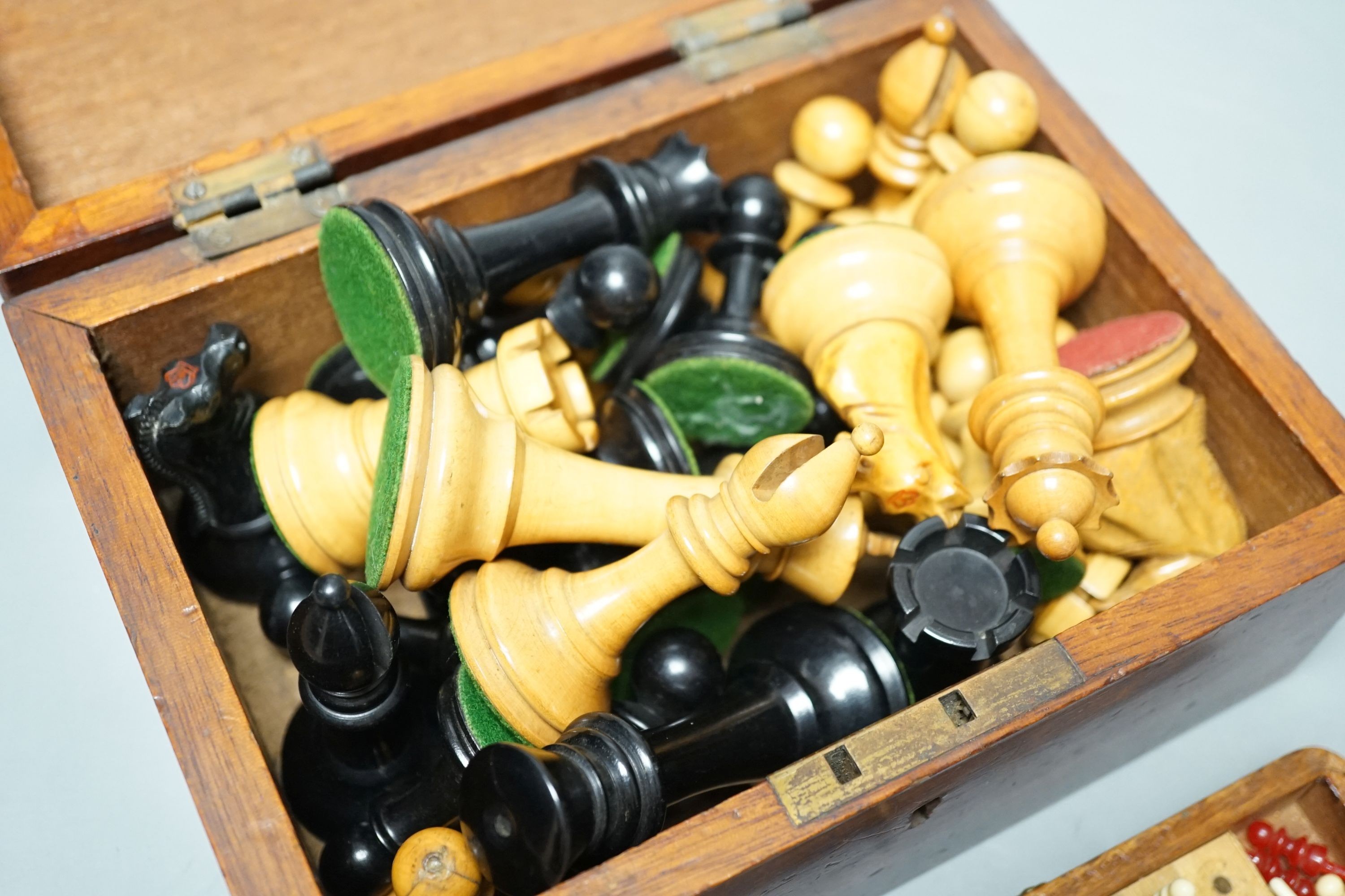 A Staunton chess set, some associate pieces and a miniature chess set. King height - 9cm
